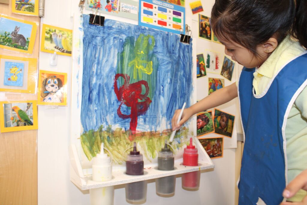 Children's Day student creating art in the classroom.