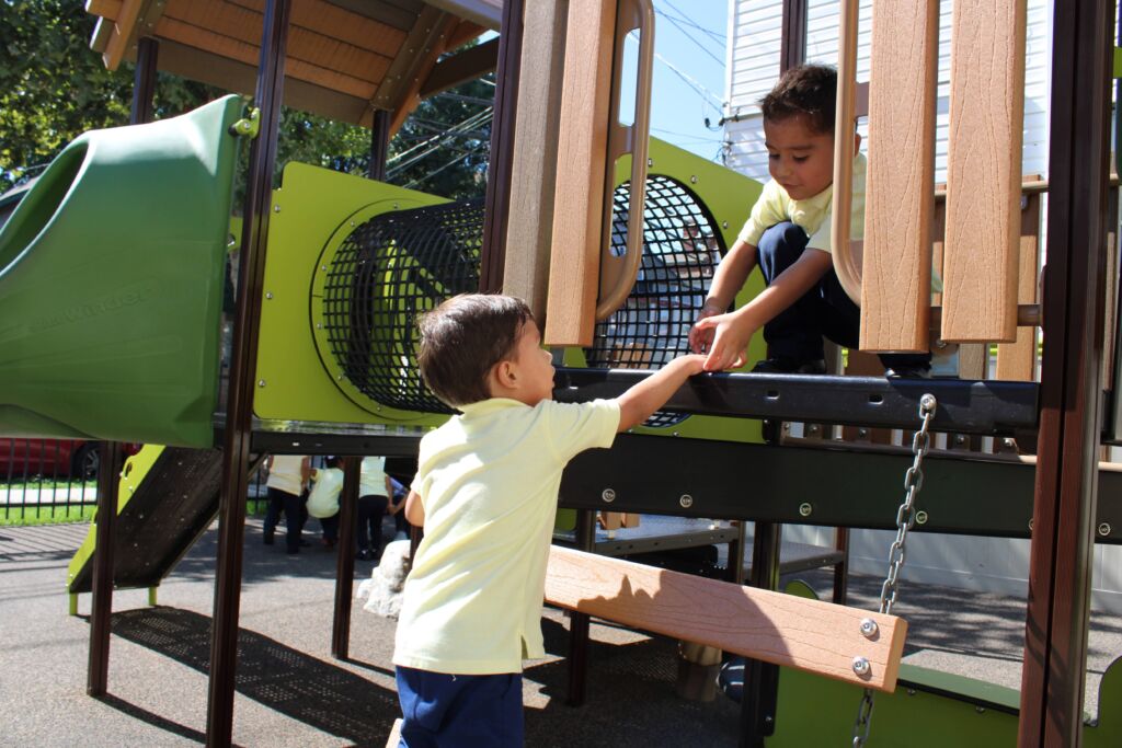 Children's Day students playing outside on the playground together.